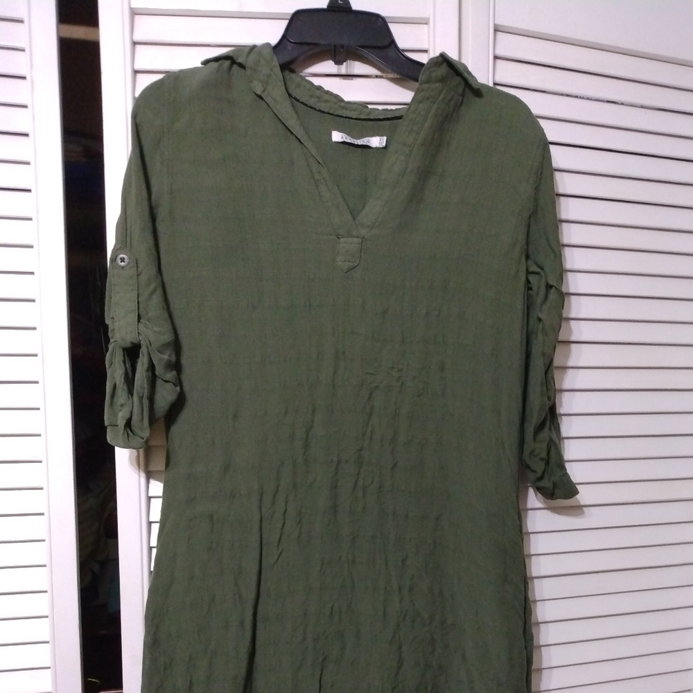 A green mid length dress, extra small (xs), also has pockets.